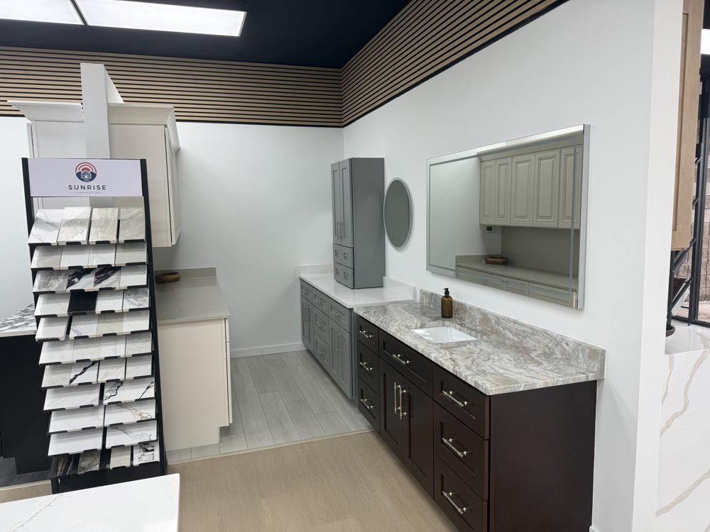 Bathroom vanity display with mirror and stone countertop